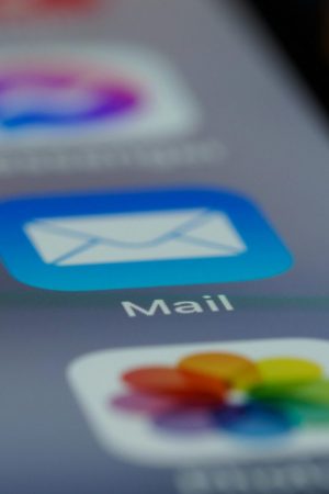 Detailed close-up of an email app icon on a smartphone screen, showcasing modern technology.